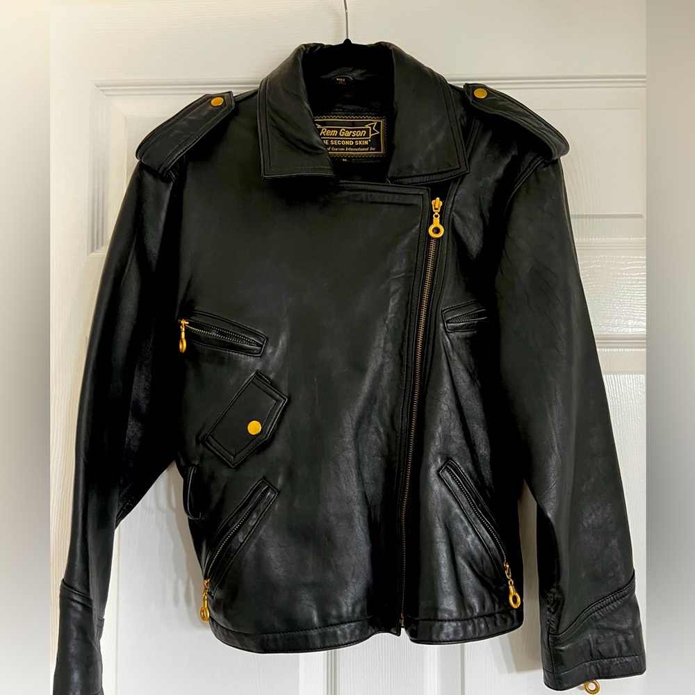 Black buttery soft leather jacket with gold hardware.